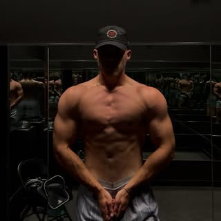Portrait of Alek Threinen, strength and powerlifting coach at Iron Physique